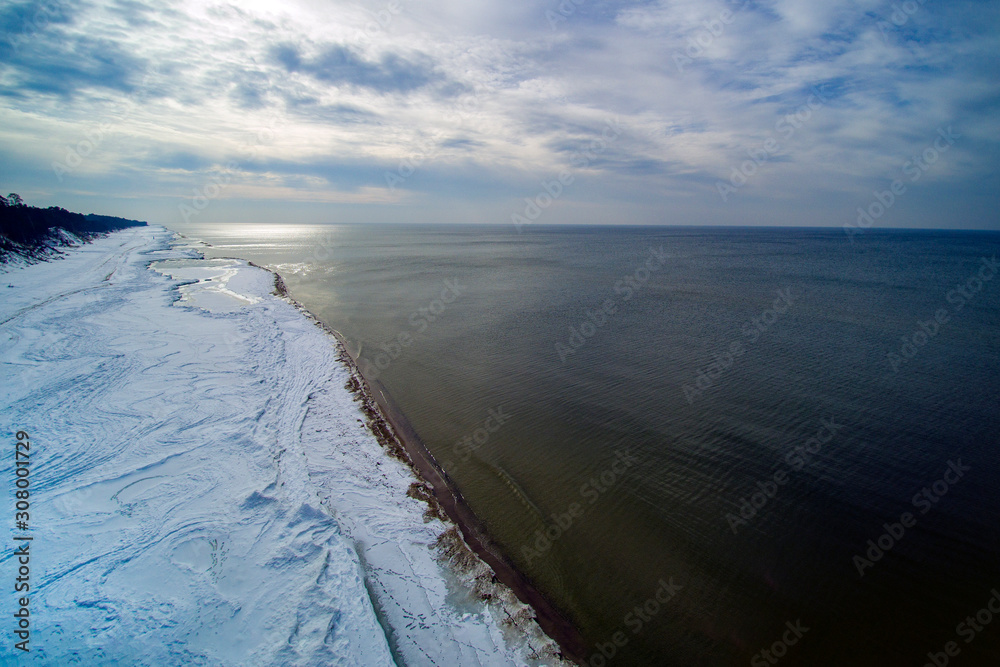 Snowy coast of Baltic sea in winter.