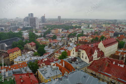 Tallinn Old Town, Estonia, panoramic view on rainy weather with traditional red tile roofs, medieval  walls.