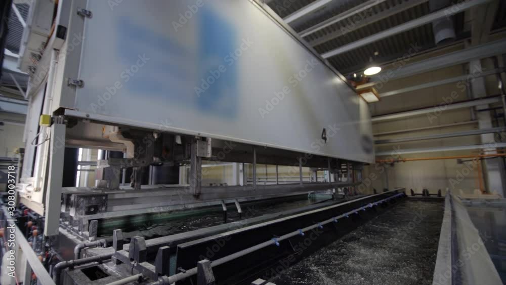 Electrolytic passivation process to increase the thickness of the natural oxide layer on the surface of metal parts. Anodizing, aluminium production line factory Electrolytic passivation process to increase the thickness of the natural oxide layer on the surface of metal parts. Anodizing, aluminium production line factory