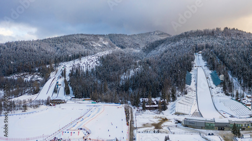 Large ski jump in Zakopane called Huge Krokiew names Stanislawa Marusarza, winter aerial view. photo