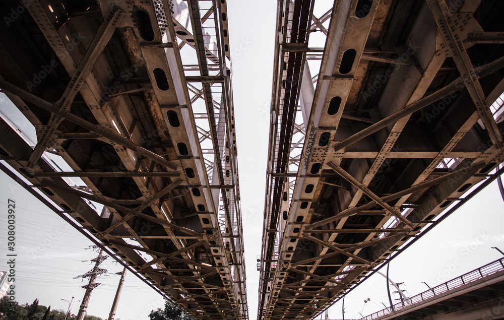 Railroad Bridge metal structure. Bottom view of the railway bridge.