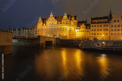 Evening streets of old Gdansk, bridge over the main river, central tourist street called long market.