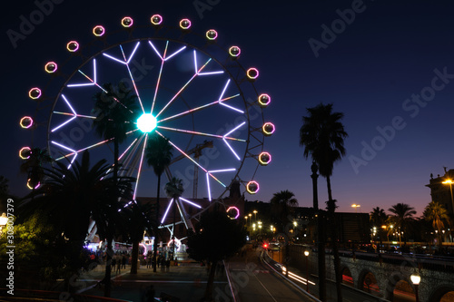 Ferris wheel in Christmas time at Columbus, Barcelona, Spain