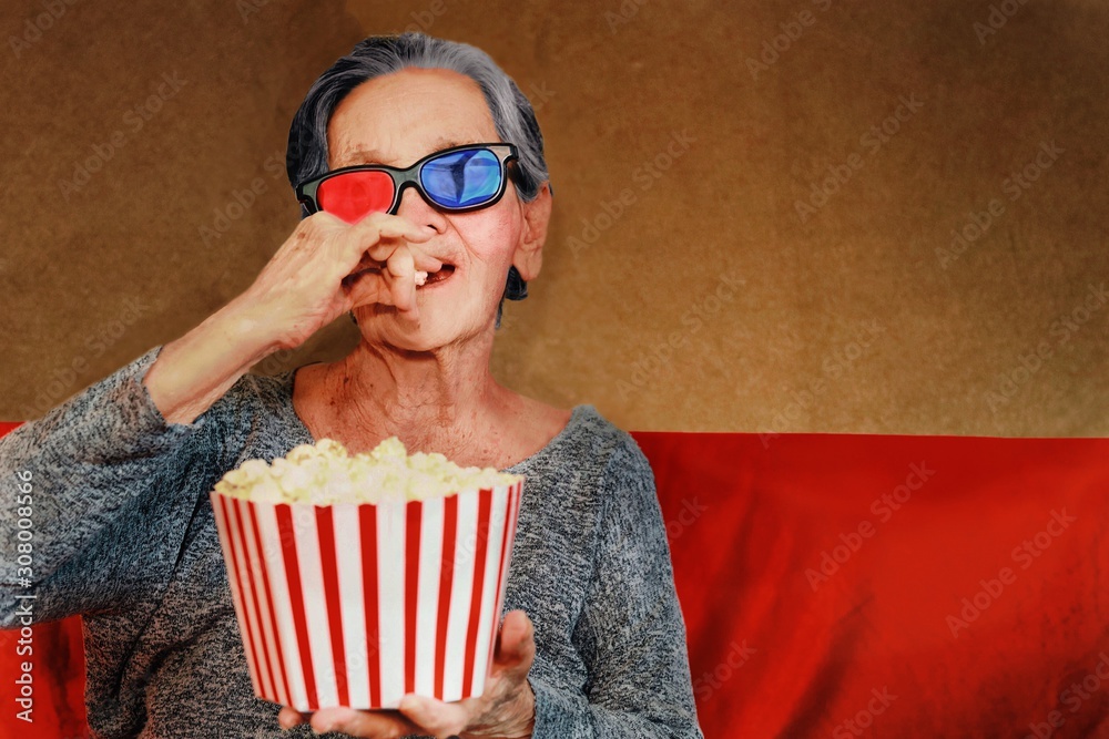 Elderly  with popcorn and 3d glasses