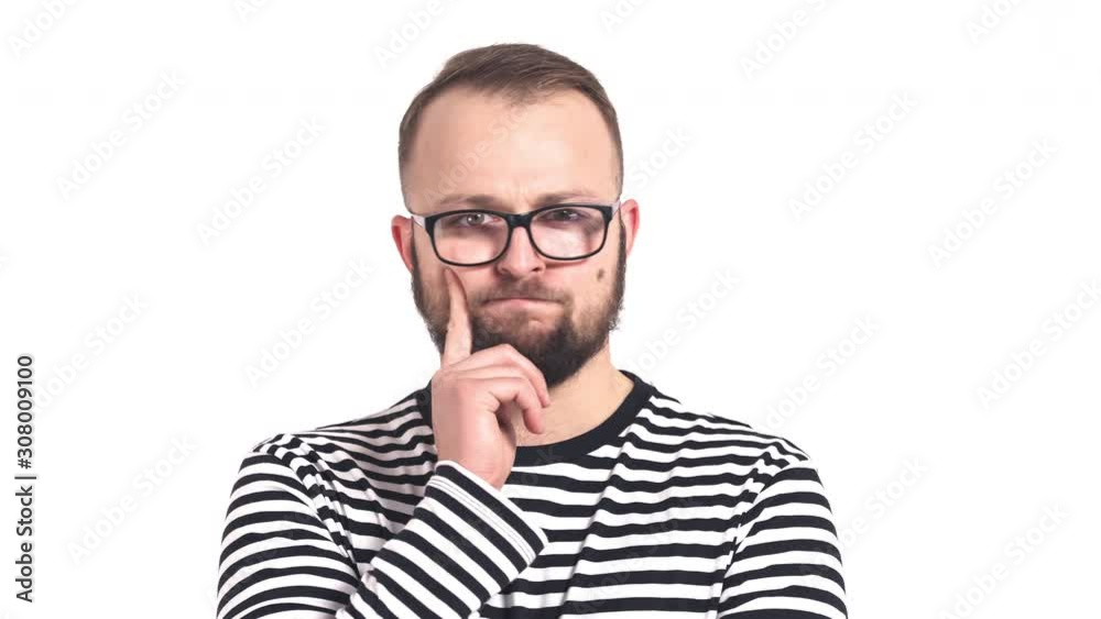 Young Caucasian man thinking, wondering. Pensive man portrait shot. Emotion of disagreement Young Caucasian man thinking, wondering. Pensive man portrait shot. Emotion of disagreement