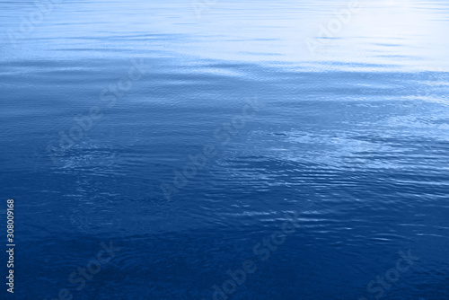 Blue water surface with ripples on the sea.