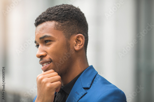 handsome young african man in a blue jacket