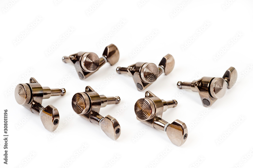 Machine heads.close up shot of electric and acoustic guitars on a white background Machine heads.close up shot of electric and acoustic guitars on a white background