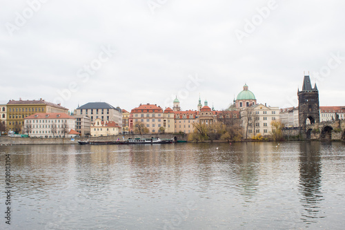  Cityscape of the Czech capital Prague and the Vltava river. View of Charles Bridge and Prague Castle on Christmas Eve. © Olena