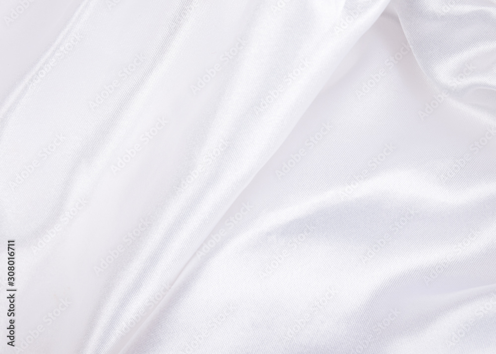 Extreme macro shot of folded white silk (as an abstract curved background or silk texture), shallow DOF, selective focus
