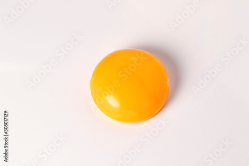 Egg yolk on white background