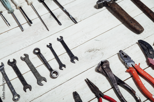 construction hammers screwdriver repair tool pliers on the board photo