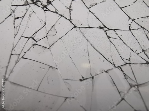 Broken glass texture. Cracked glass. Close-up photography.