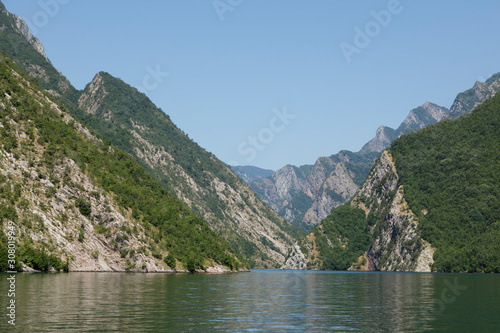 Beautiful landscape with mountains and green forests on a boat trip on the Komani lake in the dinaric alps of Albania