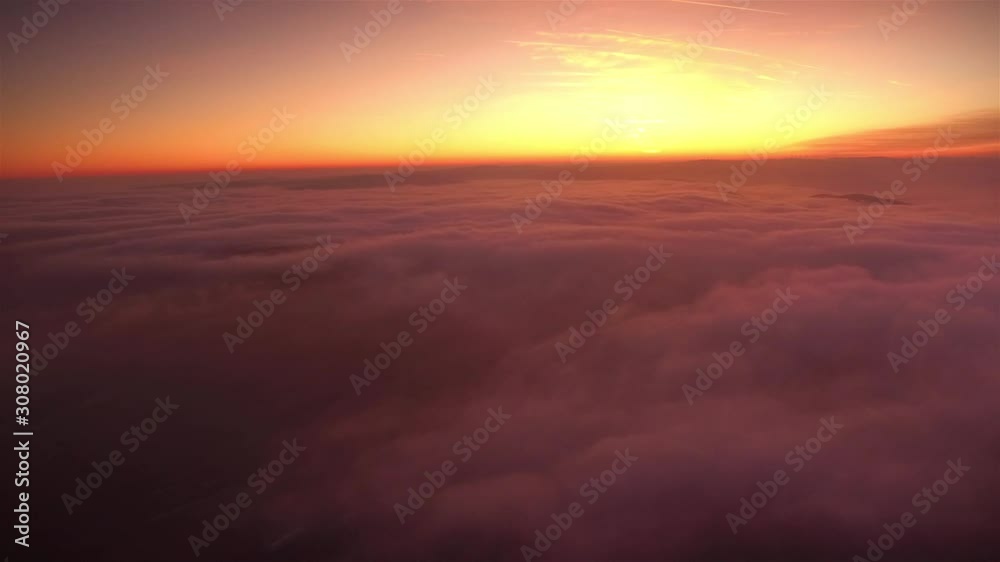 Fly over Clouds and mountains break through in the sunset Fly over Clouds and mountains break through in the sunset