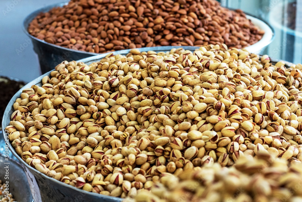 Heap of delicious fresh nuts (pistachios and almonds) in the eastern bazaar. Heap of delicious fresh nuts (pistachios and almonds) in the eastern bazaar.