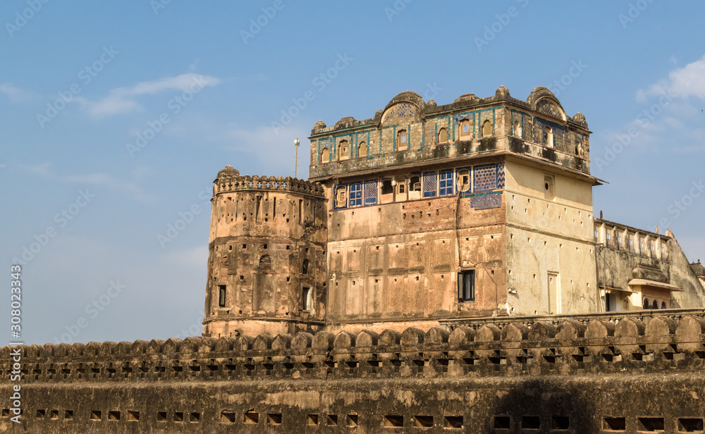 A view of the exterior facade and architectural details of the ancient palace of Jehangir Mahal from the Raja Mahal in Orchha, Madhya Pradesh, India.
