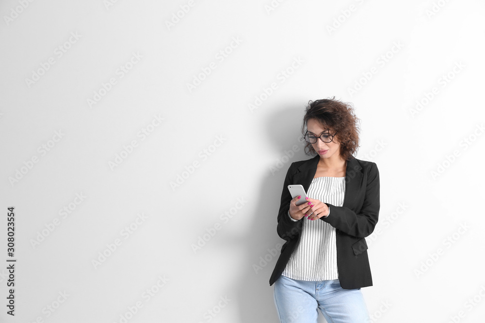 Beautiful woman using phone on white background Beautiful woman using phone on white background