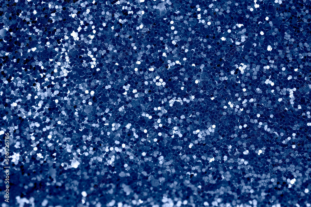 Abstract background with glitter in 2020 classic blue color. Modern sparkly backdrop with beautiful bokeh and copyspace. Abstract background with glitter in 2020 classic blue color. Modern sparkly backdrop with beautiful bokeh and copyspace.