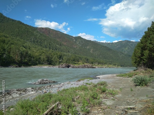 magnificent landscape river on the shore in the Altai mountains tourist trip in the summer of Russia in the rocky gorge