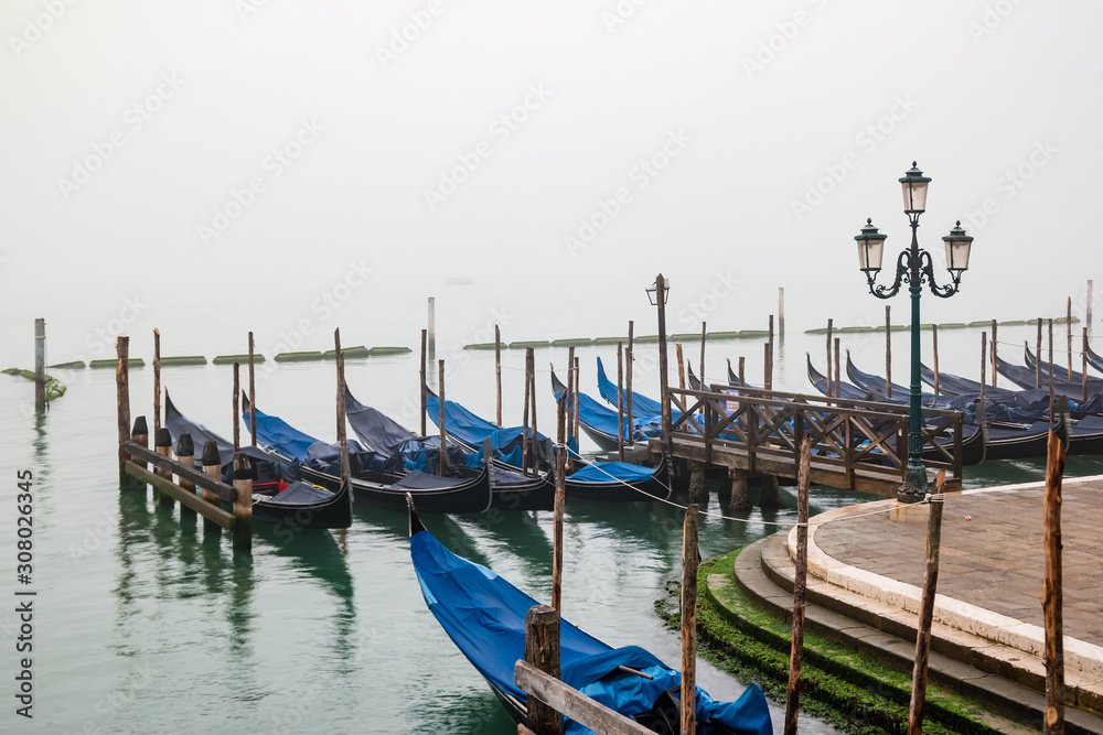 Mystical foggy early morning in Venice, Italy