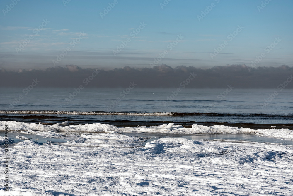 Snowy coast of Baltic sea in winter.