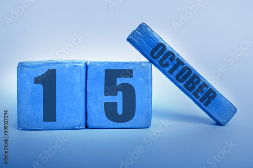 october 15th. Day 15 of month, Handmade wood cube calendar with date month and day in trendy classic blue color of the year autumn month, day of the year concept