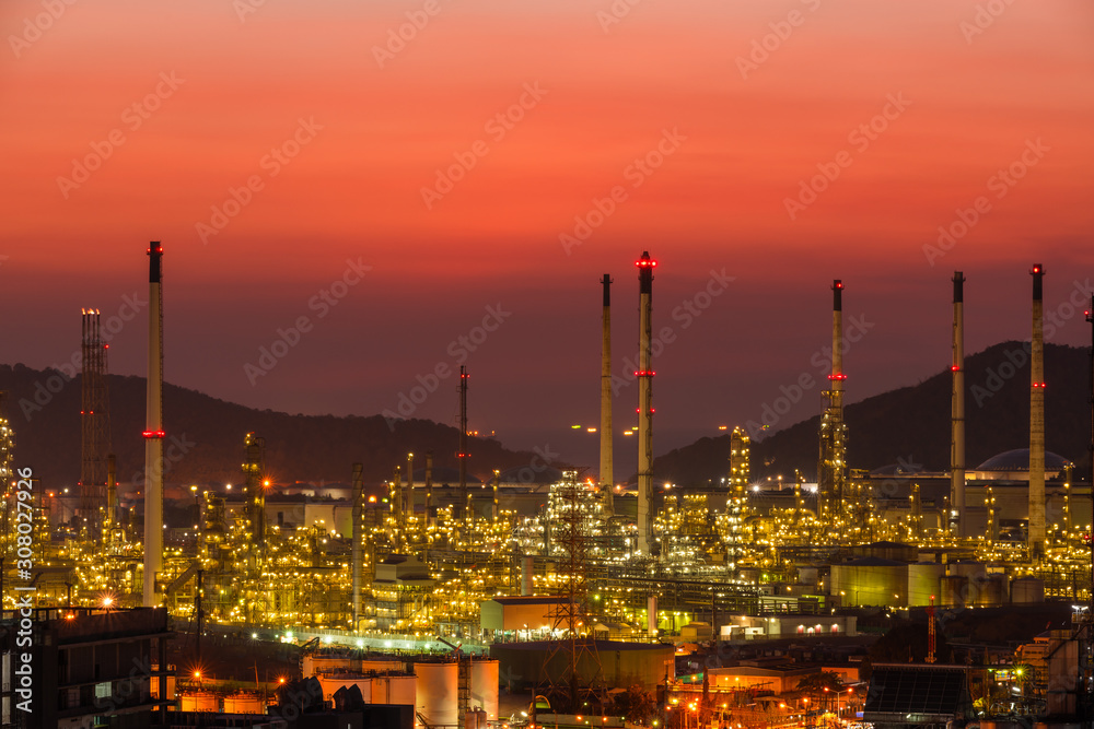 The colorful lights in oil refinery industry power station at night time with Twilight sky ,Chonburi,Thailand.