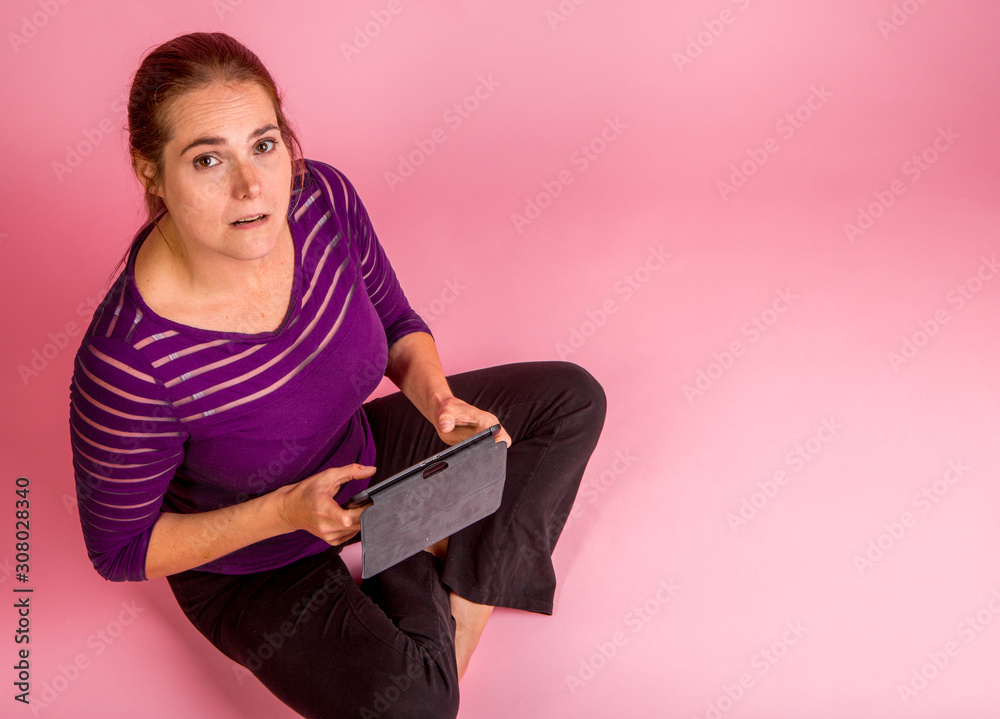 Woman reading a tablet Woman reading a tablet
