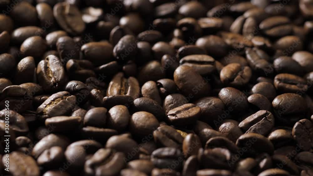 Coffee beans rotate on the pan Coffee beans rotate on the pan
