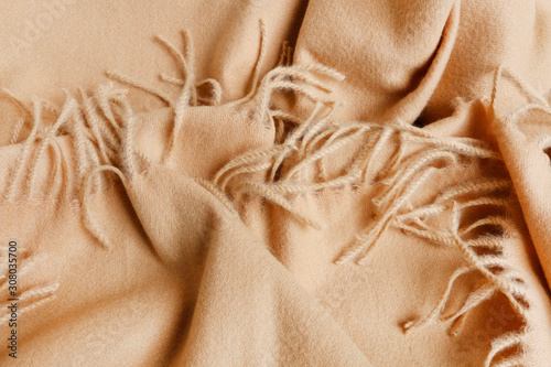 A soft beige blanket background.