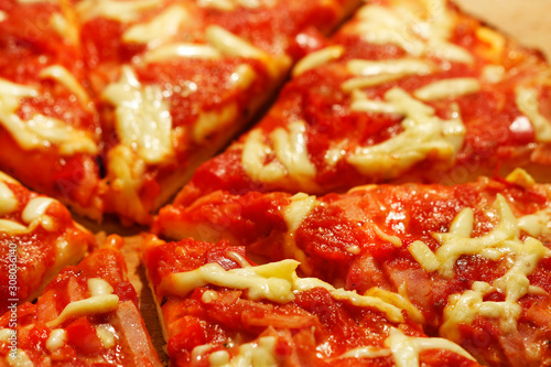 Real homemade italian pizza with tomatoes and cheese.