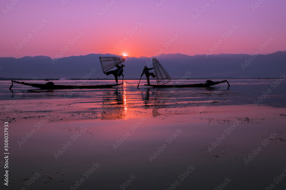 Fisherman on the Inle lake / Fisherman in the morning on Inle Lake, Myanmar, Asia.