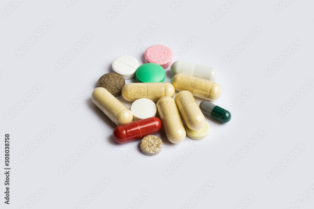 A bunch of medicines isolated on white background, different pills. A bunch of medicines isolated on white background, different pills.