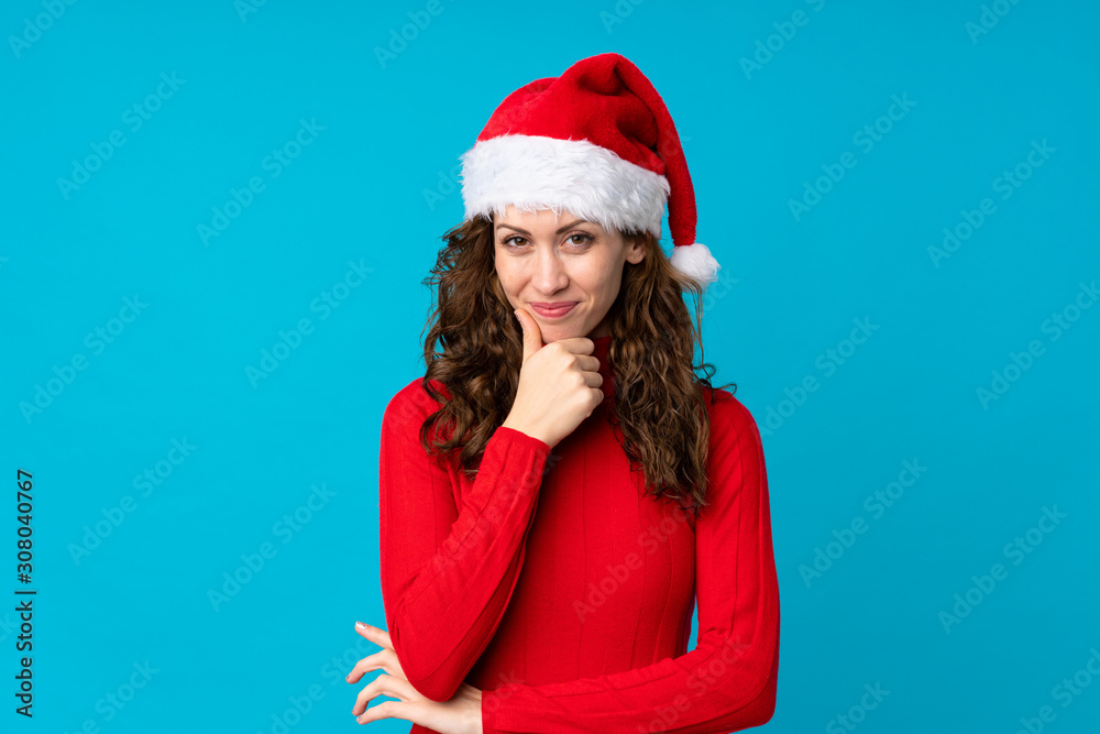 Girl with christmas hat over isolated yellow background laughing Girl with christmas hat over isolated yellow background laughing