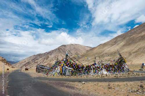 Ladakh, India - Jul 12 2019 - Tibetan prayer flag at Kiagar La Pass in Ladakh, Jammu and Kashmir, India. Kiagar La is situated at an altitude of around 4843m above the sea level.