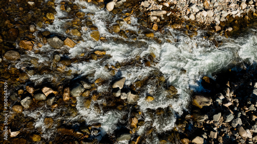 Raging water in threshold of the mountain river Raging water in threshold of the mountain river