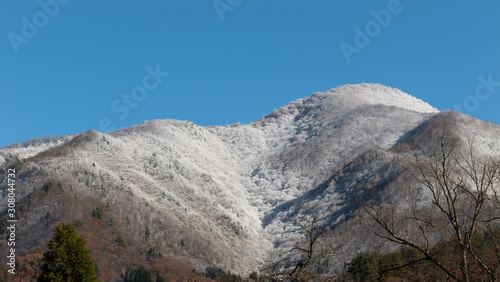 Snowy hill clouds, snow and fog, winter time landscape. photo