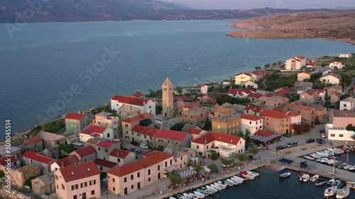 Tranquil Vinjerac, Croatia, retreating aerial from Catholic church photo