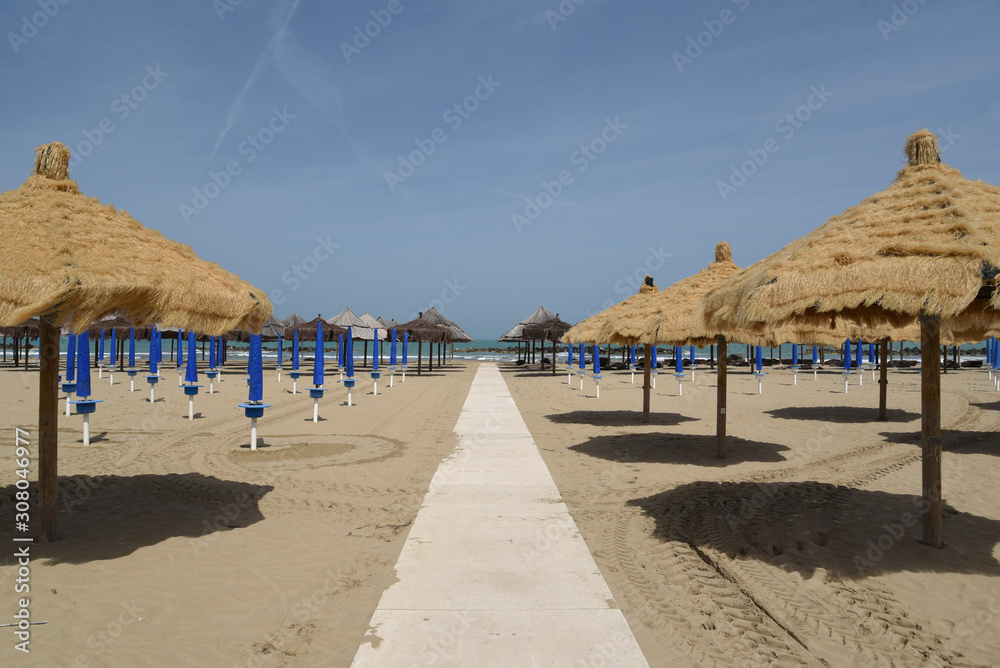 Umbrellas on the Sea by Morning at Season Start Umbrellas on the Sea by Morning at Season Start