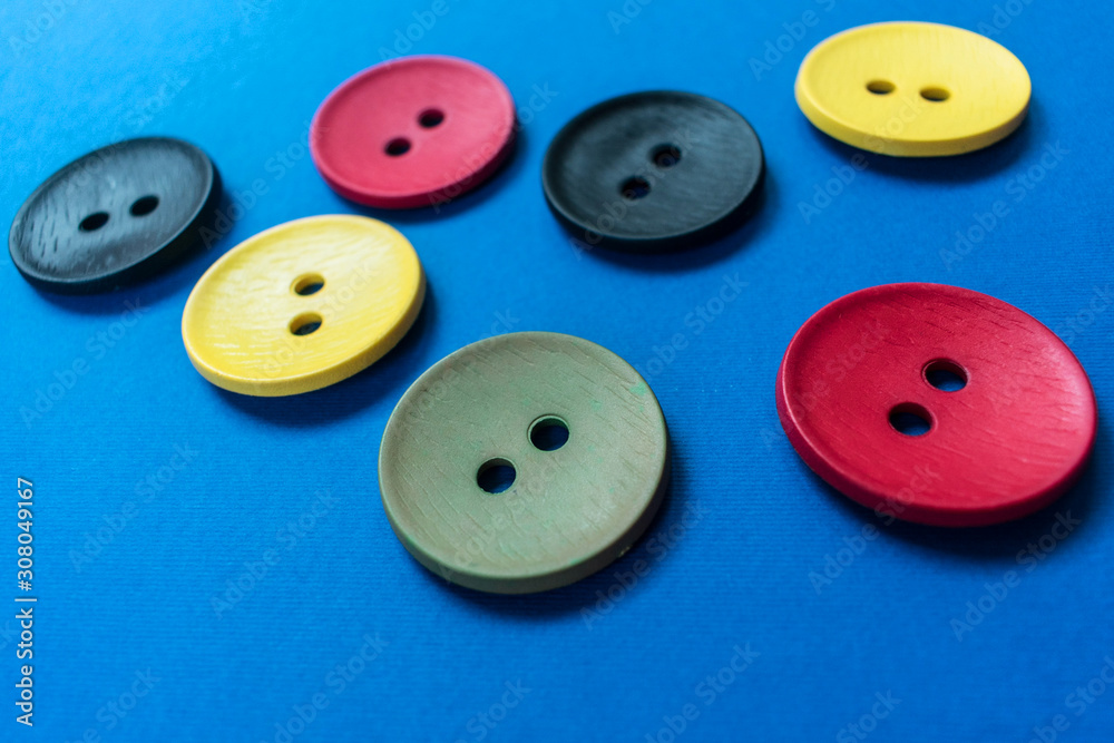 Large multi-colored buttons on a blue background. Large multi-colored buttons on a blue background.