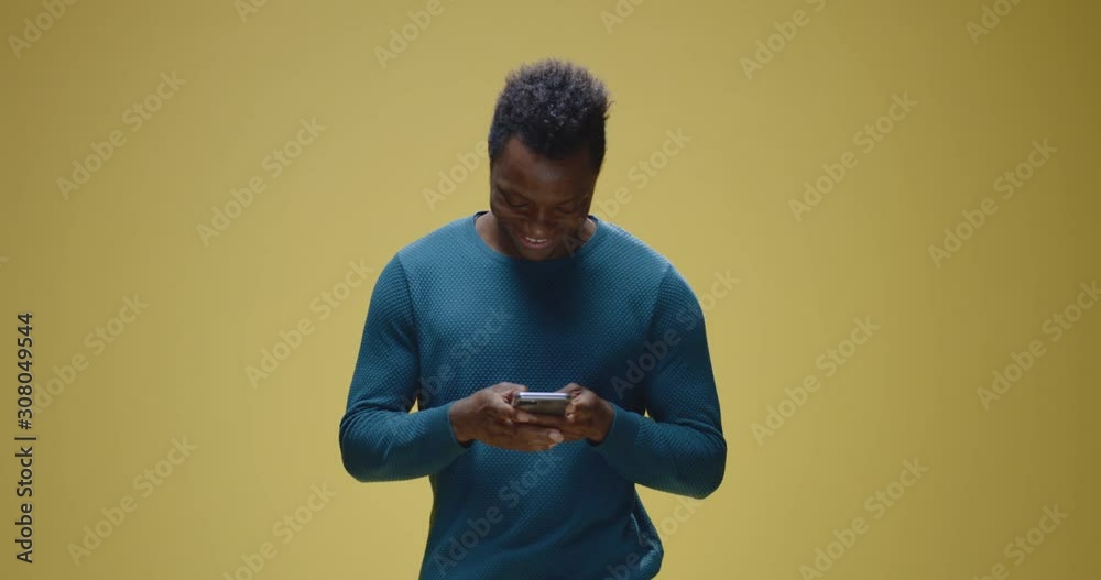 Young man chatting on his smartphone