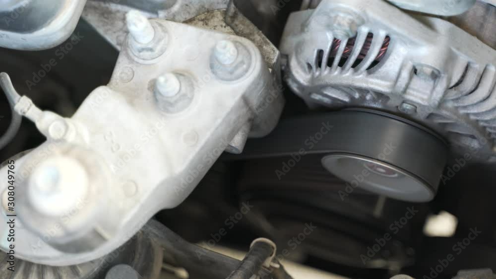 Car timing belt or cambelt on old engine with shaking and loud noise