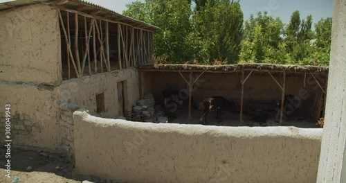 Adobe, clay cowshed house in Ferghana Valley Uzbekistan Central Asia photo