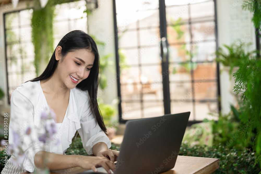 business women and laptop in the garden business women and laptop in the garden