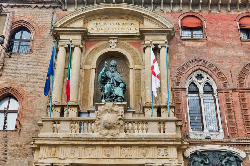 Accursio Palace with statue of Pope Gregory in Bologna, Italy.