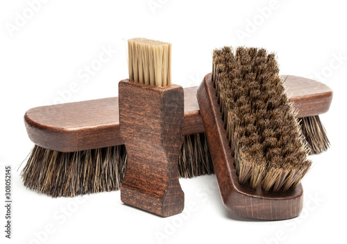 Shoe brushes and horsehair polishing brush isolated on white background