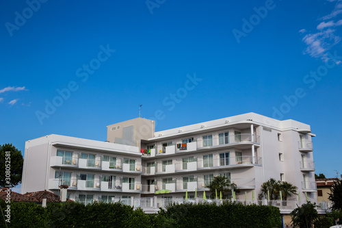 Newly built apartment block with beautiful blue sky in the background