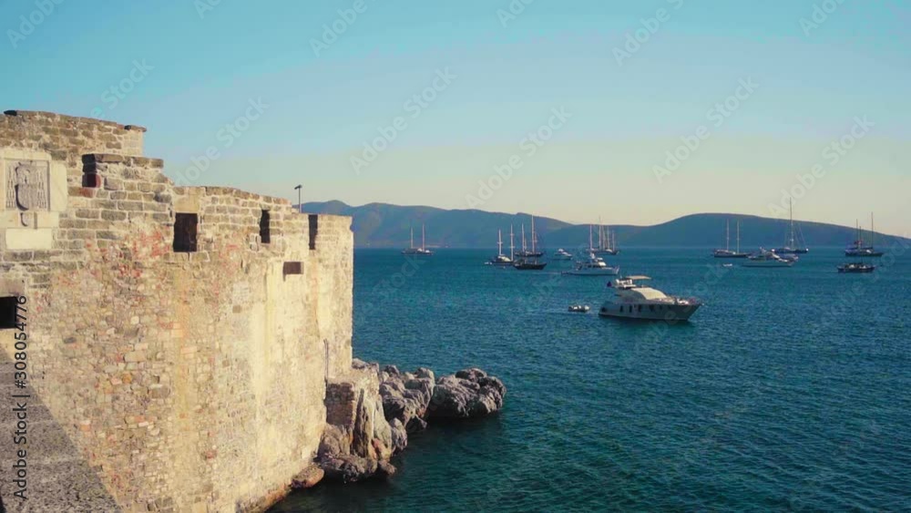 View over ships at the Mediterranian coast as seen from the historical castle 'Bodrum Kalesi' in Bodrum, Turkey View over ships at the Mediterranian coast as seen from the historical castle 'Bodrum Kalesi' in Bodrum, Turkey