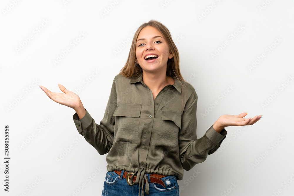 Lithuanian blonde girl over isolated white background smiling a lot